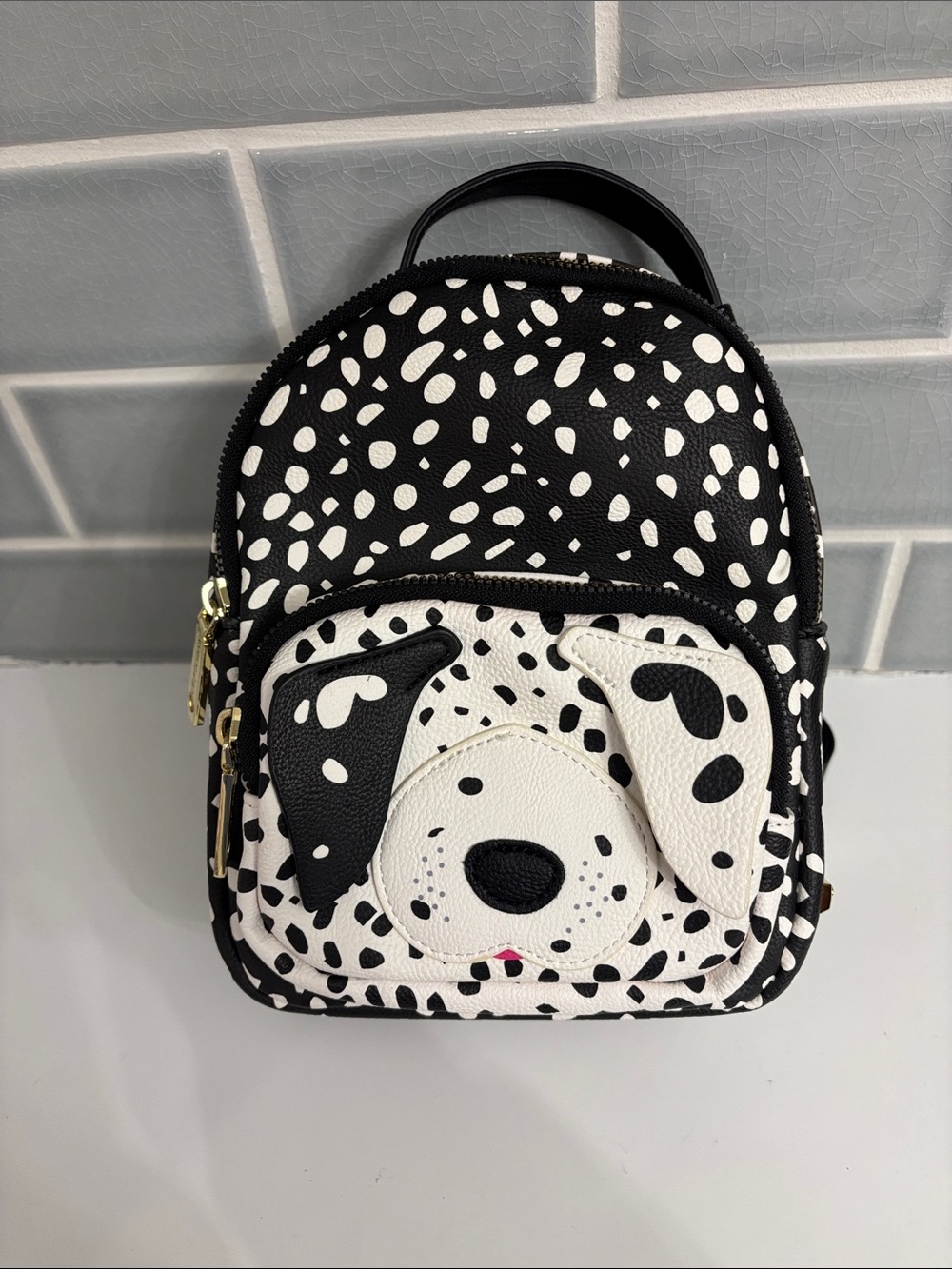 Betsey Johnson Kitsch Dalmatian Mini Backpack featuring a black-and-white speckl
